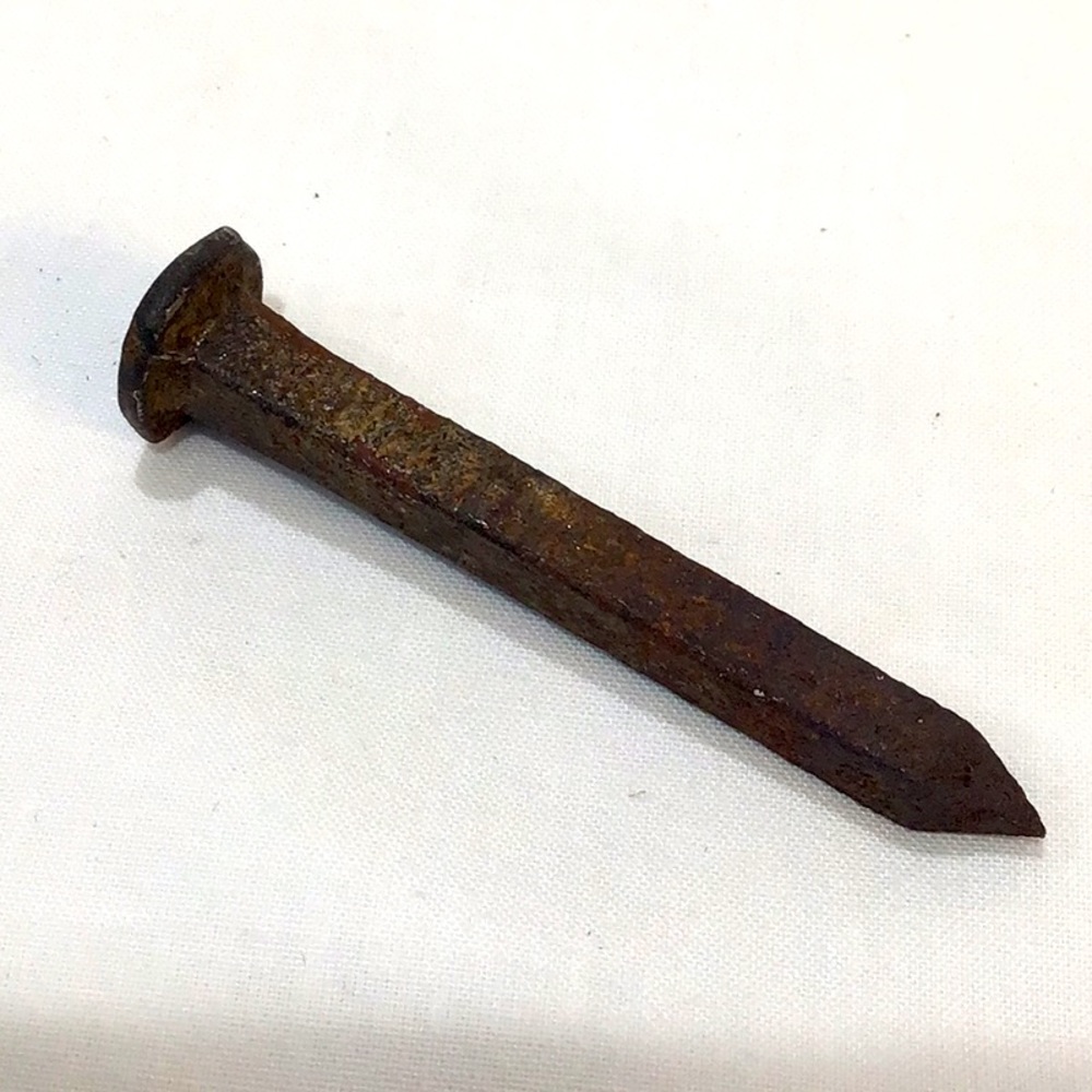 Hand forged antique square nail with flat sides